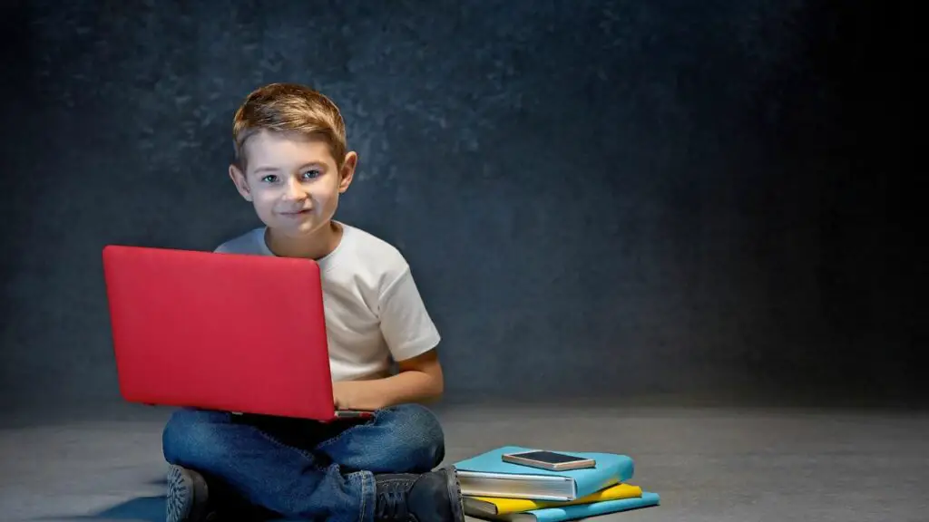 boy with a red laptop