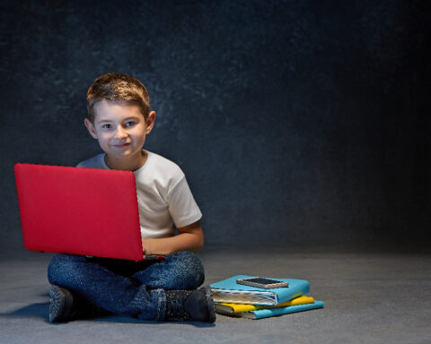 boy with red laptop