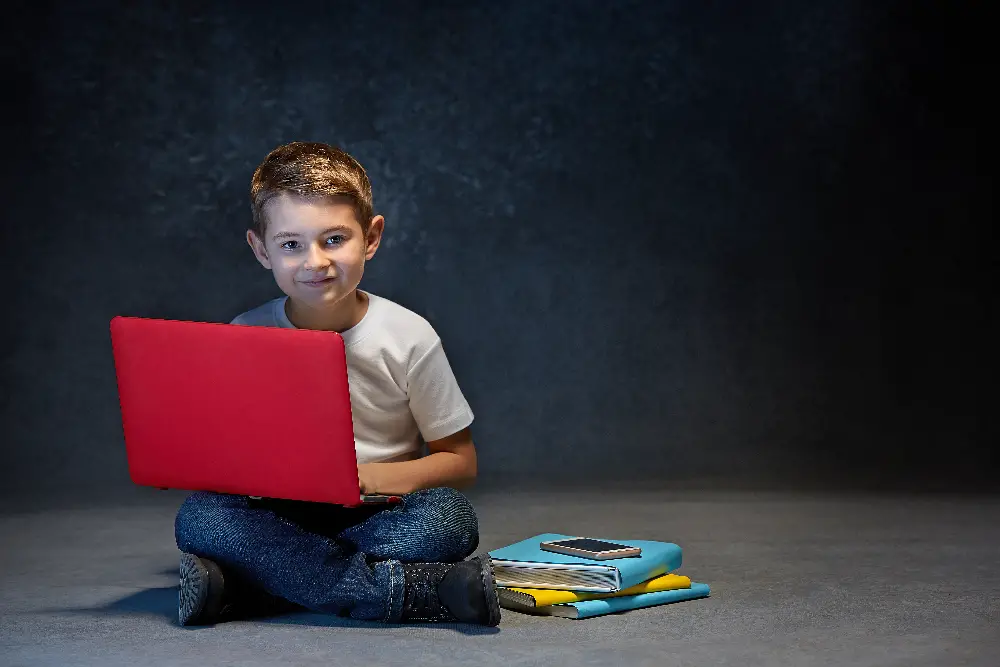 boy with red laptop