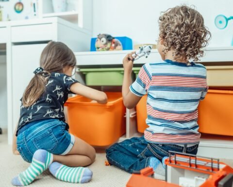 kids playing with toys in a new room 