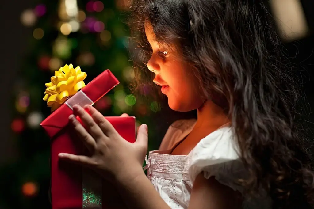 child with gift pack